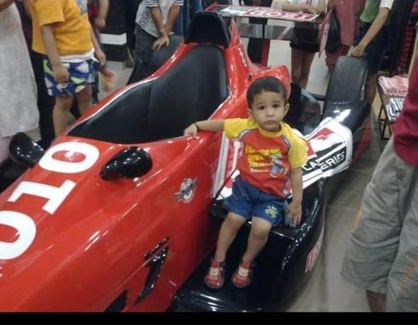 In a toy F1 car as a toddler